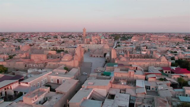 Old Bukhara city (Uzbekistan) panorama in the rays of the setting sun, shot by a drone