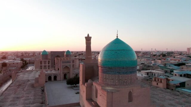 Old Bukhara city (Uzbekistan) panorama in the rays of the setting sun, shot by a drone