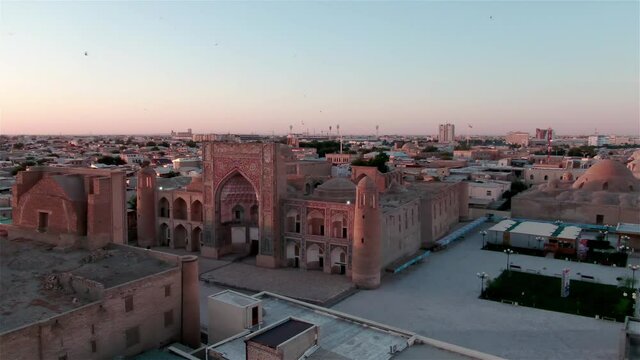 Old Bukhara city (Uzbekistan) panorama in the rays of the setting sun, shot by a drone
