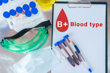 Determination of blood group. A Notepad labeled blood type b+. The concept of a blood test. The...