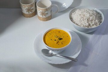 Delicious south Indian style mango curry with white rice, white background