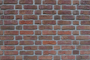 Real vintage Bumpy, rough and old brick texture with imperfect, dilapidate, impair , corroded and defective flemish brick bond pattern.