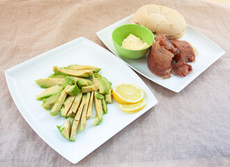 Ingredients for meat and avocado sandwich