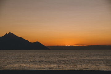Naklejka na ściany i meble Peaceful sunrise at the sea