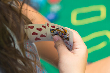Woman with two poker game cards