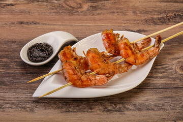 Grilled prawn skewer with pepper sauce