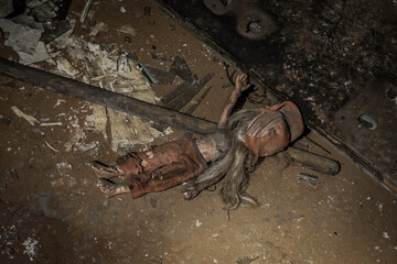 Dirty, old and abandoned doll found in a basement