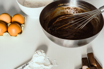 A bowl of cake mix on a white background