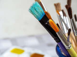 Background with brushes for painting of different sizes and purposes. Clean space for text.