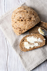 slices of sliced homemade rye bread with butter top view