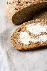 slices of sliced homemade rye bread with butter