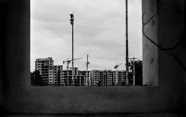 
you would see a construction in the background and it would look like a black and white painting