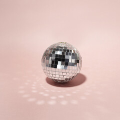 Disco ball on pink background. Minimal party concept.