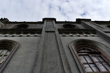 bottom view on wall with windows of old castle