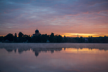 island ancient monastery in the middle of the lake at sunrise