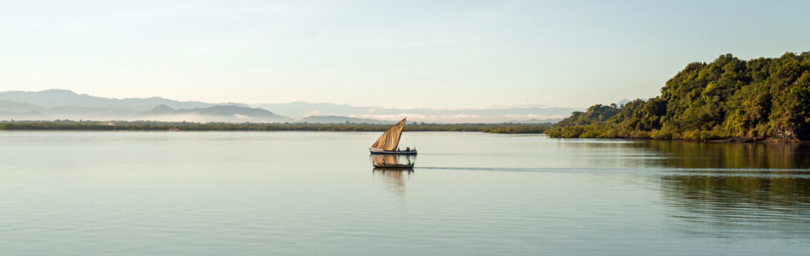 Nosy Be, Madagascar: Traditional Sailing Boat And Canoe Sail Out On The Indian Ocean From Port Ankify, Ambanja District, Northern Madagascar. 