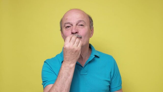 Pleasant Senior Man Blowing Air Kiss To His Wife, Looks With Great Love And Sympathy At Her