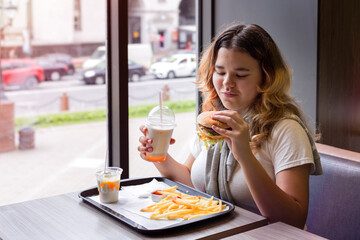 Junk food. Young girl. Toned. Close-up.