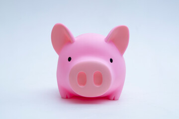 Piggy Bank with coins on a white background.