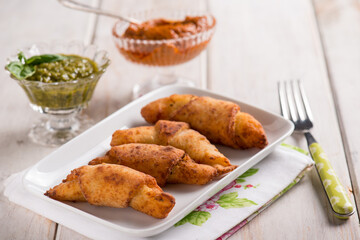 panzerotti filled with red pesto and basil pesto sauce