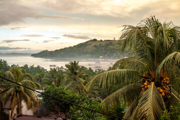 Early morning view over a bay near Hell Ville on Nosy Be, Northern Madagdascar after a tropical...