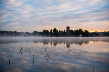 island ancient monastery in the middle of the lake at sunrise