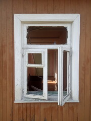 Old window frame in old wooden house