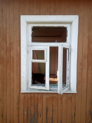 Naklejka na ściany i meble Old window frame in old wooden house 