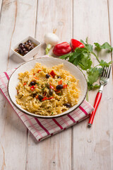 mafalde pasta with capsicum black olives and onions