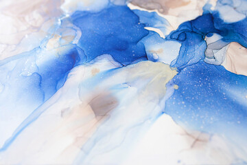 Abstract blue and silver background, wallpaper. Mixing acrylic paints. Modern art. Alcohol ink...