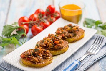 canapes with clam with tomatoes sauce and turmeric spice