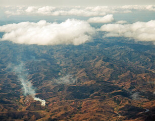 Fototapeta premium Eastern Madagascar: aerial view of burning, deforested and degraded hills 