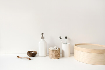 Beauty, health care morning routine products. Spa, wellness, treatment essentials. Toothbrushes, ear sticks, liquid soap cream on white table