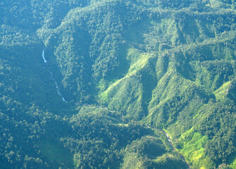 Fototapeta na wymiar Eastern Madagascar: aerial view of a river valley in a partially forest covered area 