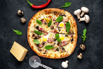 Pizza carbonara with bacon, cheese, mushrooms, quail eggs, creamy sauce on a stone background
