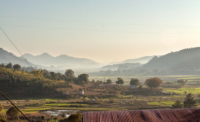 Early morning view from the main road between Moramanga and Antananarivo, on a misty valley with...