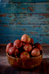 red apples on a wooden table