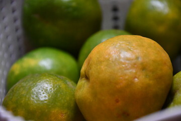 beautiful tasty lemons on baskets