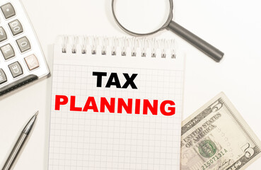 the text caption showing the tax deductions. Business concept writing for Finance input tax deduction of the money written on the Notepad, magnifier and dollars, calculator