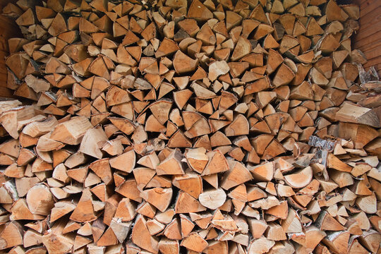 The lots of firewood logs stacked in a pile. Bathhouse concept.