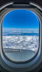 view from airplane window clouds landscape