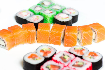 set of different types of sushi on a white plate