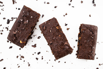 Brownie pieces on white background. Delicious chocolate pie.
