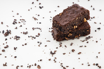 Brownie pieces on white background. Delicious chocolate pie.