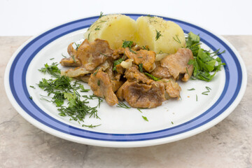 Stewed chanterelles in white sauce with boiled potatoes.