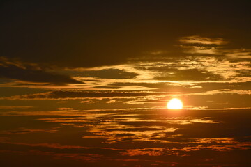 The sunrise on a picturesque cloudy sky.
