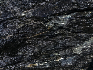texture photography with wet black stone