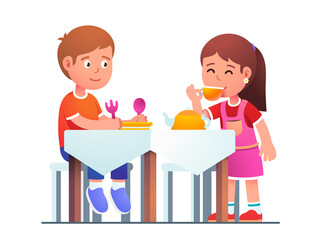 Kids boy and girl playing family dinner together