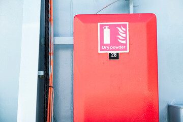 Dry powder fire extinguisher red cabinet on ferry ship
