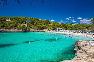 CALA MONDRAGO, Majorka, Spain, 24 July 2020 - People enjoy the beach in summer, Parque Natural de Mondrago. Santanyi. Malorca. Spain